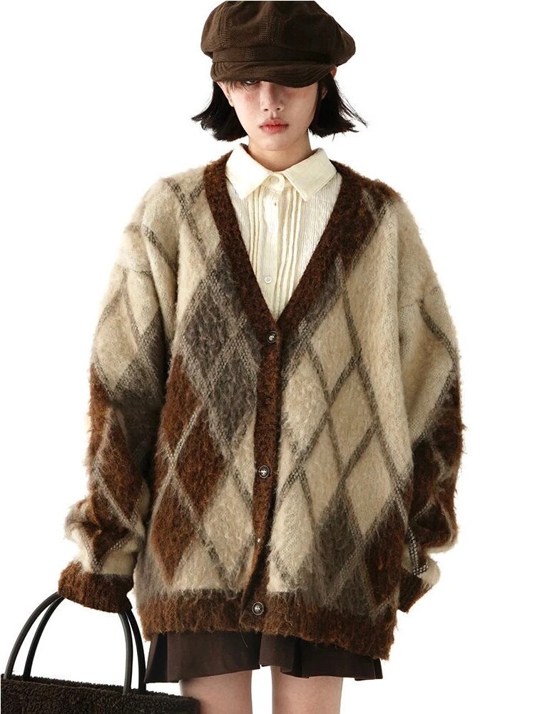 Brown and cream oversized argyle cardigan with a V-neck and button front, styled over a cream shirt; shirt and accessories are not included.