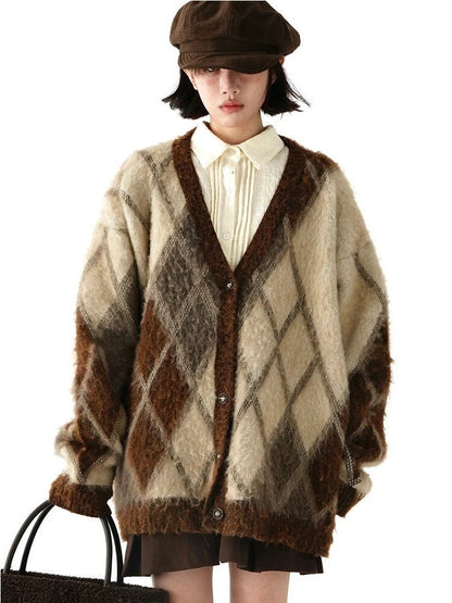 Brown and cream oversized argyle cardigan with a V-neck and button front, styled over a cream shirt; shirt and accessories are not included.