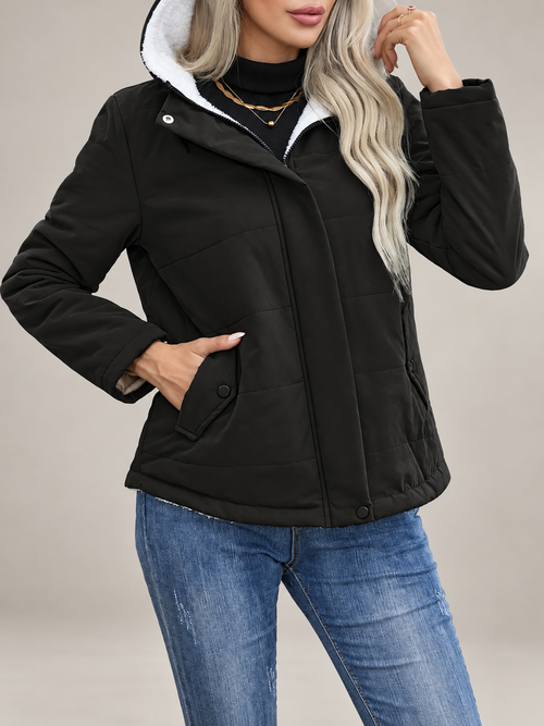 Studio presentation of black fleece-lined hooded jacket