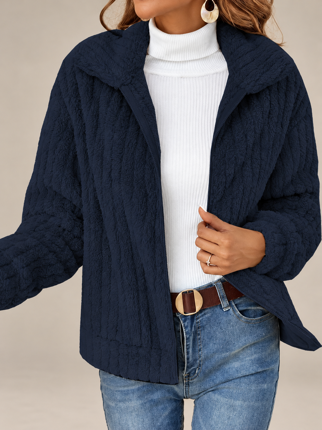 Studio presentation of navy textured fleece jacket