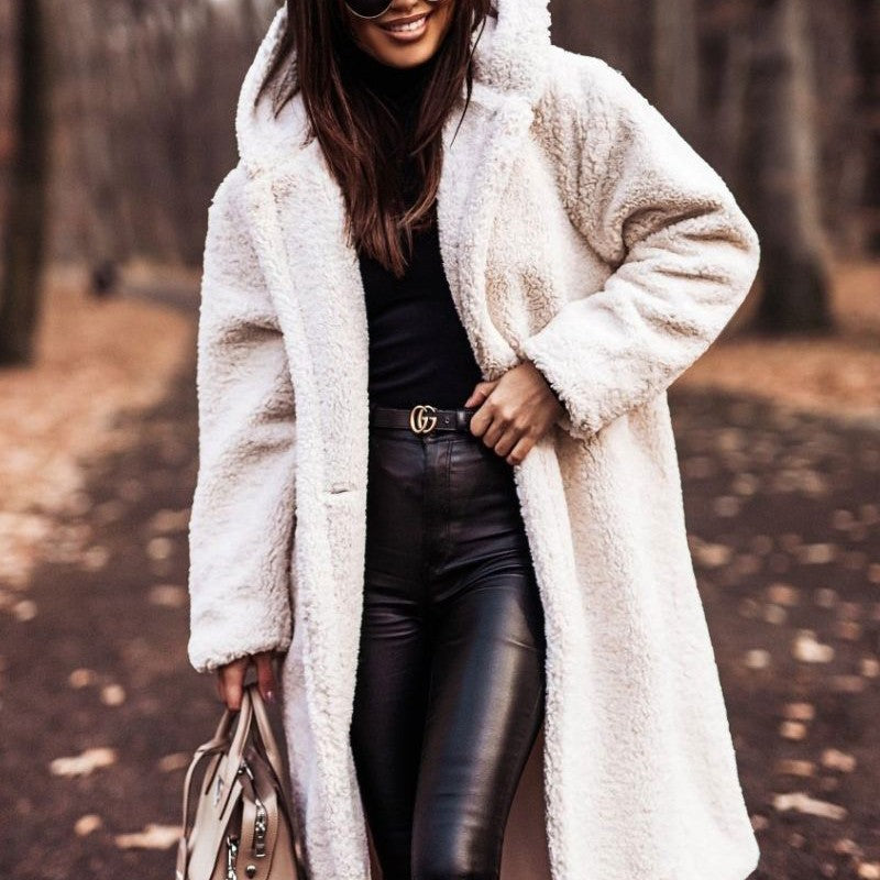 Cream longline teddy-textured hooded coat worn outdoors