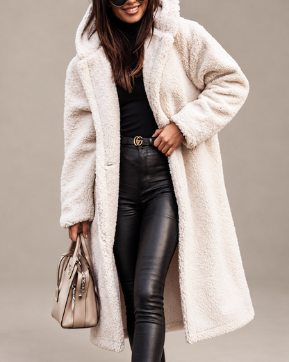 Studio presentation of cream longline teddy coat